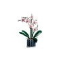 Orchidée LEGO avec fleurs blanches à cœur rose, feuilles vertes et pot gris cannelé sur fond blanc Orchidée LEGO avec fleurs blanches à cœur rose, feuilles vertes et pot gris cannelé sur fond blanc