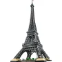 Tour Eiffel LEGO complète avec structure en treillis métallique, quatre pieds arqués et petits arbres verts à la base