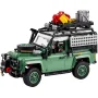 Land Rover Defender 90 LEGO vert avec galerie de toit chargée d'équipements et bagages colorés, vue de trois-quarts avant Land Rover Defender 90 LEGO vert avec galerie de toit chargée d'équipements et bagages colorés, vue de trois-quarts avant