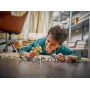 Child playing with LEGO 327th Star Corps set, building Clone Trooper minifigures on a table