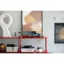 LEGO Dune Atreides Ornithopter displayed on red shelf in modern living room with minifigures