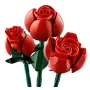 Three red LEGO roses with green stems and leaves on white background